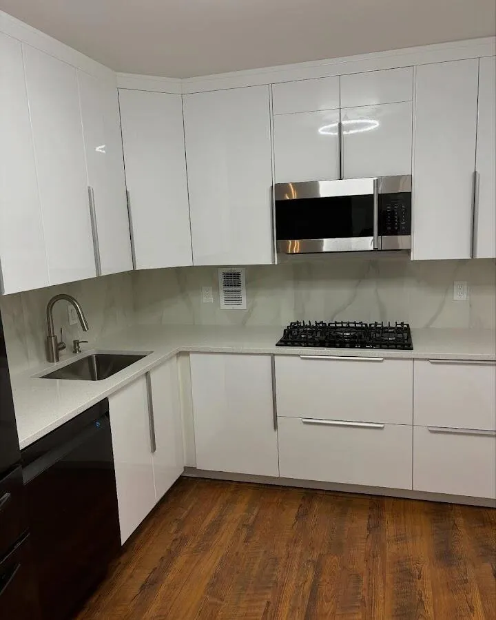 Restored kitchen with white cabinets after water damage in Middlesex